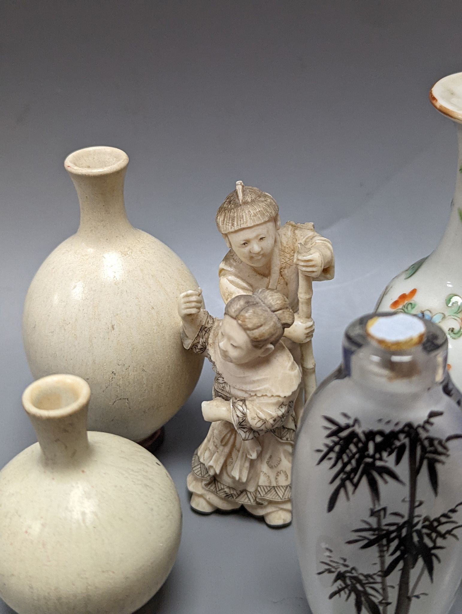 A group of Oriental ivory, inside-painted snuff bottle, soapstone carvings, etc. (14)